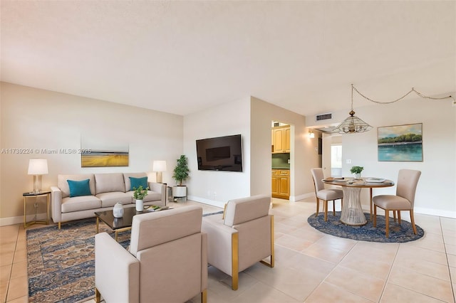 living area with baseboards and light tile patterned flooring