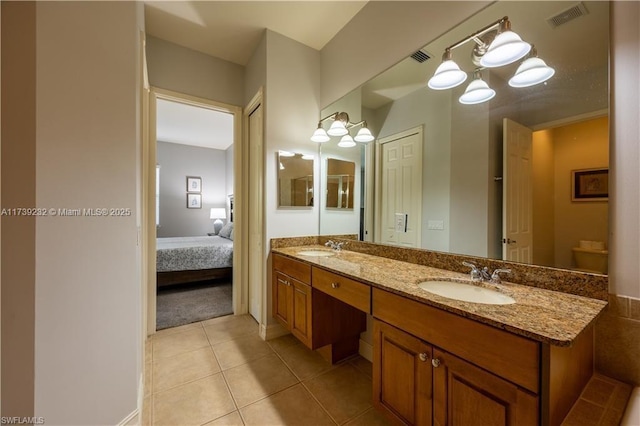 12099 Lucca St Unit 201, Fort Myers, FL 33966 - ensuite bathroom with double vanity, tile patterned flooring, and a chandelier