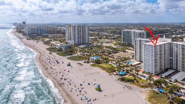 bird's eye view with a view of the beach and a water view