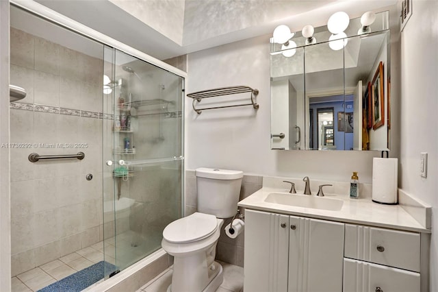 bathroom featuring vanity, walk in shower, and toilet