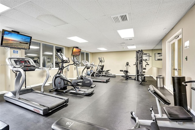 workout area featuring a paneled ceiling