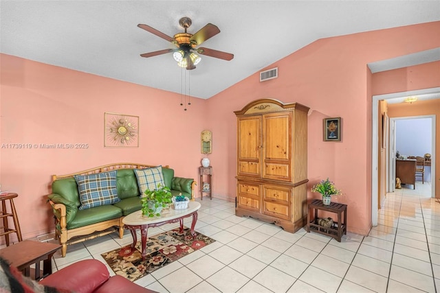 tiled living room with lofted ceiling and ceiling fan