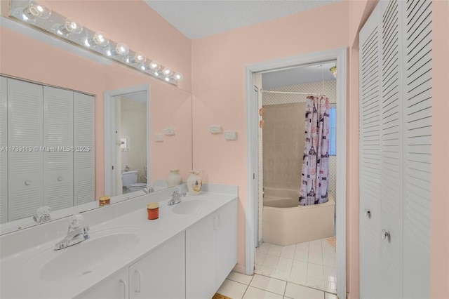 full bathroom featuring vanity, shower / bath combo, tile patterned floors, and toilet