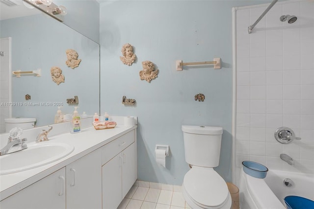 full bathroom with vanity, tile patterned flooring, tiled shower / bath combo, and toilet