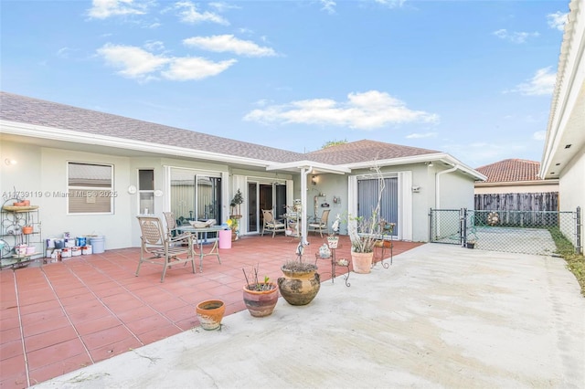 rear view of property featuring a patio