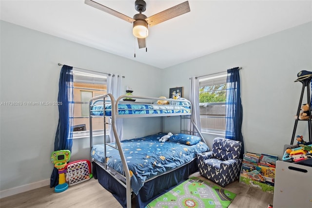 bedroom featuring ceiling fan and hardwood / wood-style floors