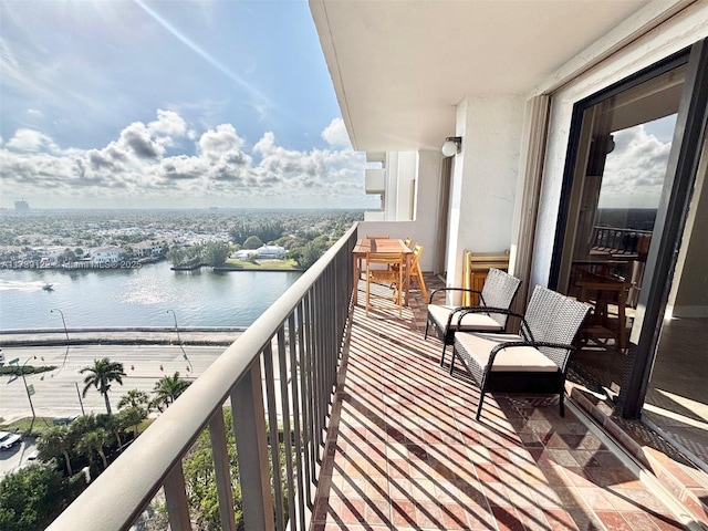 balcony featuring a water view