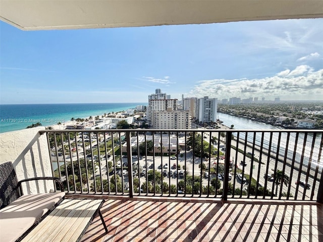 balcony with a view of the beach and a water view