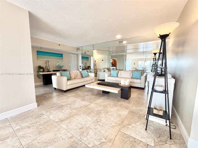 living room with a textured ceiling