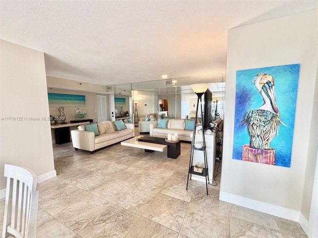 living room featuring a textured ceiling