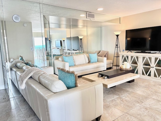 living room with a textured ceiling