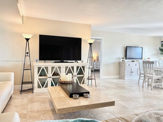 living room featuring a textured ceiling