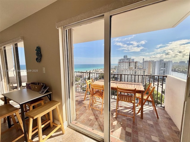 balcony featuring a water view