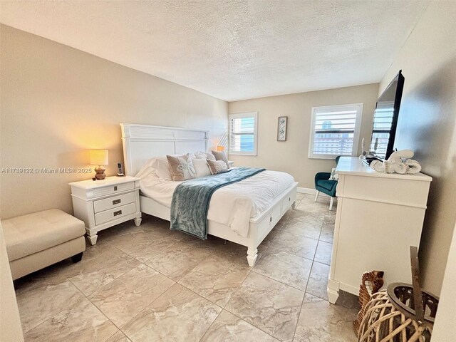 bedroom featuring a textured ceiling