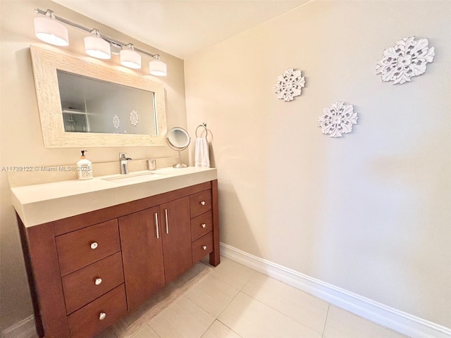 bathroom with tile patterned floors and vanity