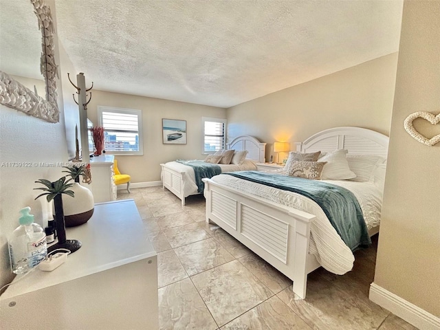 bedroom featuring a textured ceiling