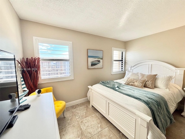 bedroom featuring a textured ceiling