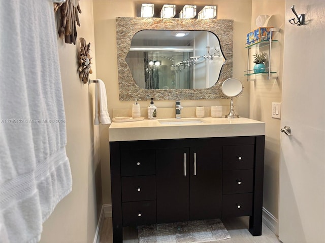 bathroom featuring vanity and a shower with shower door