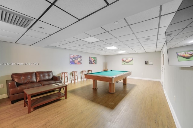 game room with a paneled ceiling, billiards, and light wood-type flooring