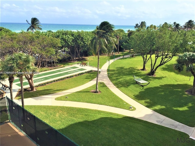 view of home's community featuring a yard and a water view