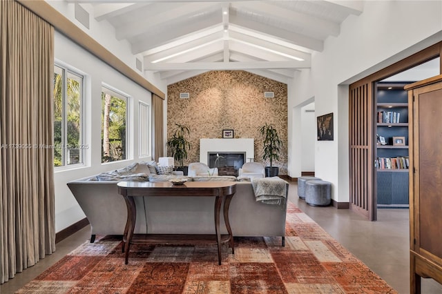 sunroom / solarium featuring vaulted ceiling with beams