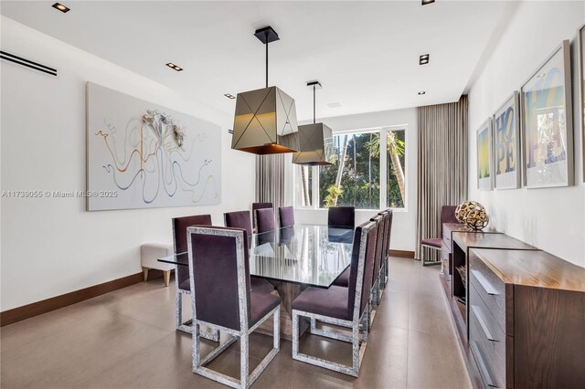 kitchen with white cabinetry, appliances with stainless steel finishes, beam ceiling, and a center island