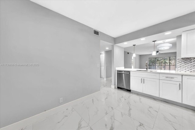 kitchen with sink, decorative light fixtures, stainless steel dishwasher, and white cabinets