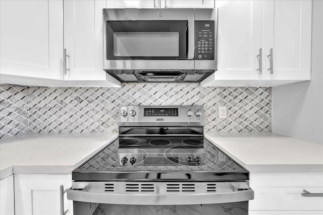 kitchen featuring white cabinetry and stainless steel appliances