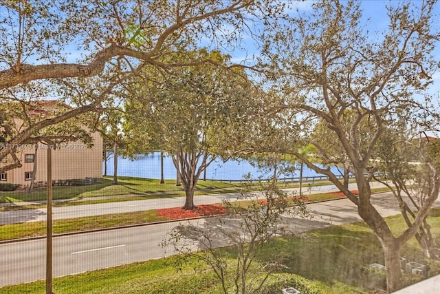 surrounding community featuring a water view