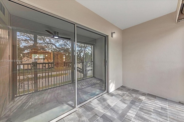 entrance to property with a balcony