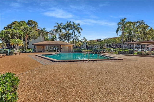 view of swimming pool with a patio area