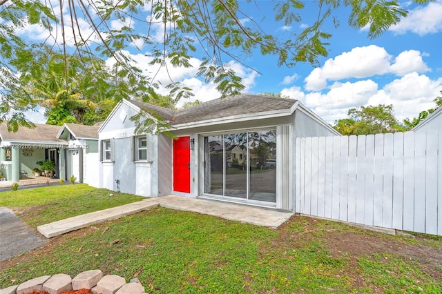 exterior space featuring a front lawn