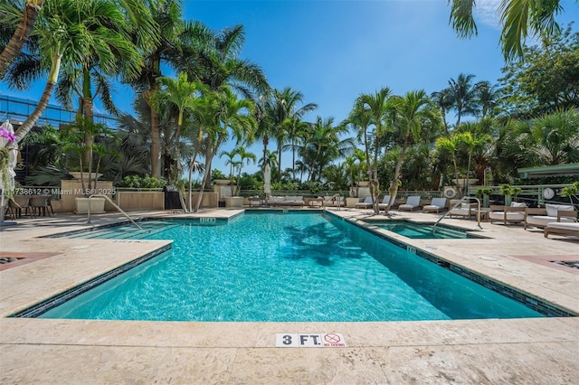 view of swimming pool with a patio area