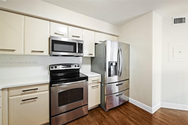 kitchen featuring dark wood-type flooring and stainless steel appliances