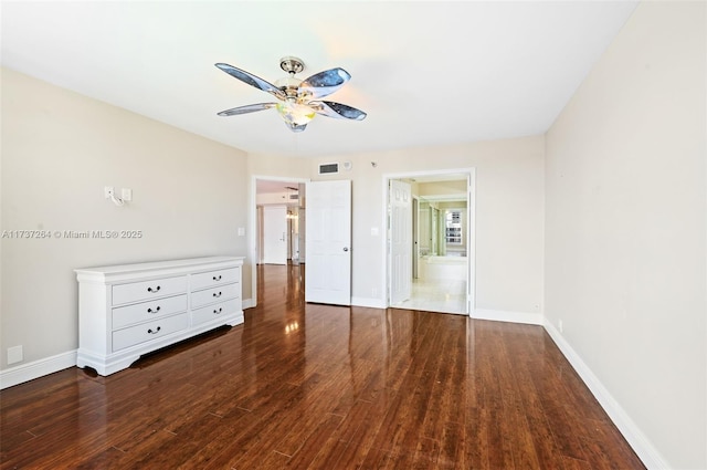 unfurnished bedroom with dark hardwood / wood-style flooring and ceiling fan