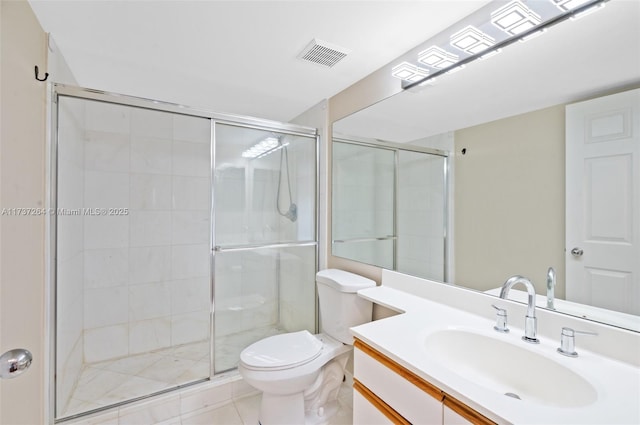 bathroom featuring walk in shower, vanity, toilet, and tile patterned flooring