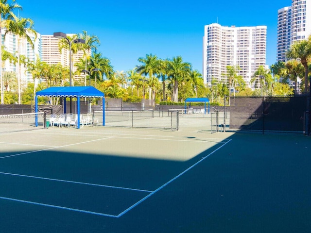 view of sport court with basketball court and a gazebo