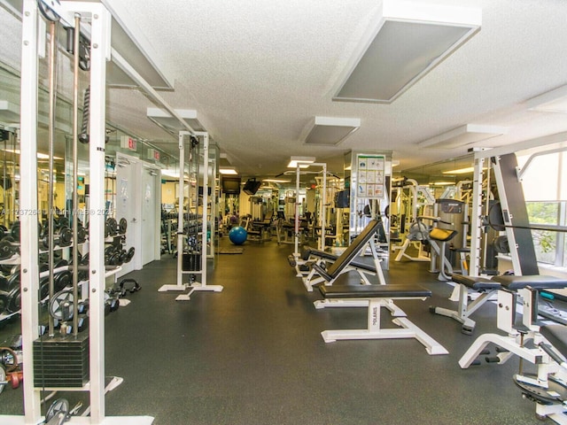 exercise room featuring a textured ceiling