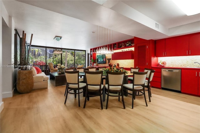 101 Ocean Lane Dr Unit 1017, Key Biscayne, FL 33149 - dining space featuring wet bar and light wood finished floors