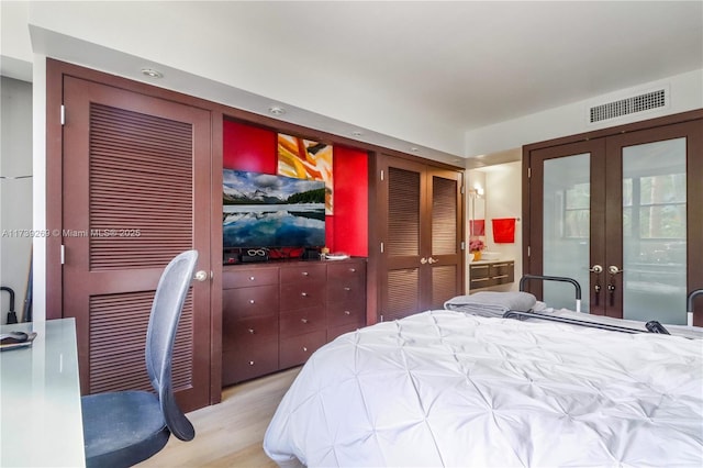 101 Ocean Lane Dr Unit 1017, Key Biscayne, FL 33149 - bedroom with french doors and wood finished floors