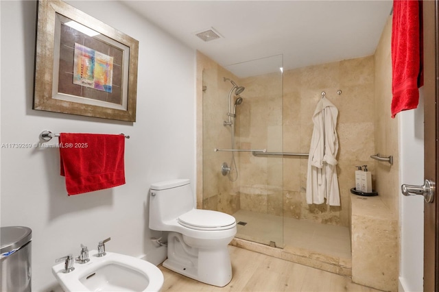 101 Ocean Lane Dr Unit 1017, Key Biscayne, FL 33149 - bathroom featuring toilet, a tile shower, a bidet, and wood finished floors