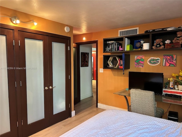 101 Ocean Lane Dr Unit 1017, Key Biscayne, FL 33149 - bedroom with wood finished floors, french doors, and baseboards