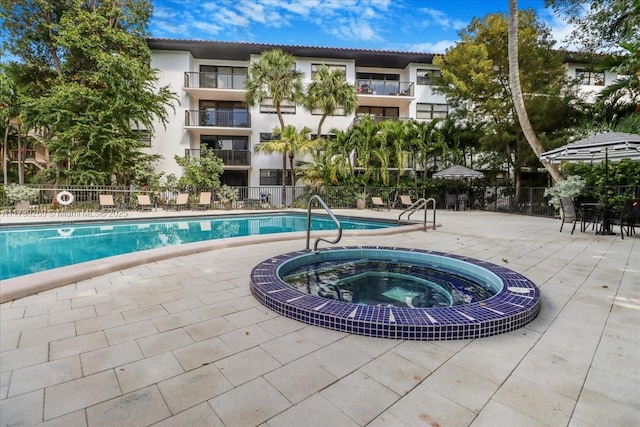 101 Ocean Lane Dr Unit 1017, Key Biscayne, FL 33149 - community pool with a community hot tub and a patio