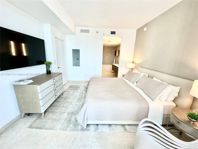 bedroom featuring electric panel and visible vents