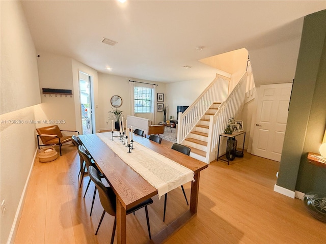 dining room with light hardwood / wood-style floors