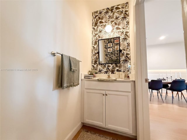 bathroom featuring vanity and wood-type flooring