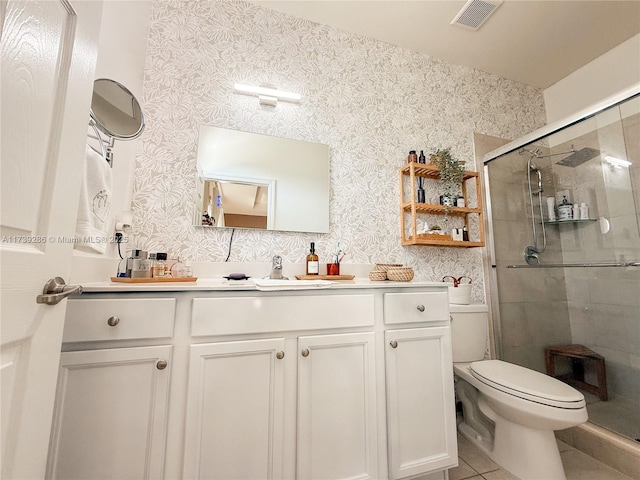 bathroom with walk in shower, tile patterned floors, vanity, and toilet