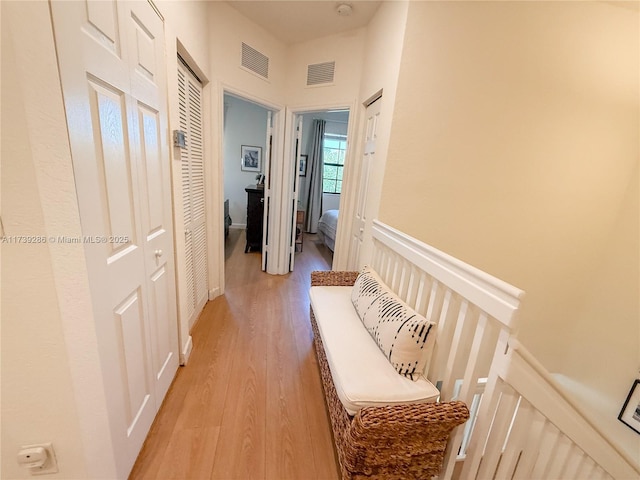 hall with light hardwood / wood-style flooring