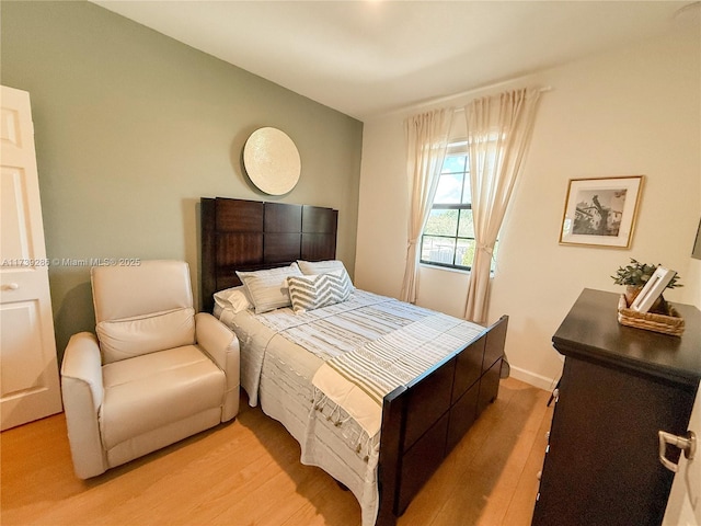 bedroom with light hardwood / wood-style floors