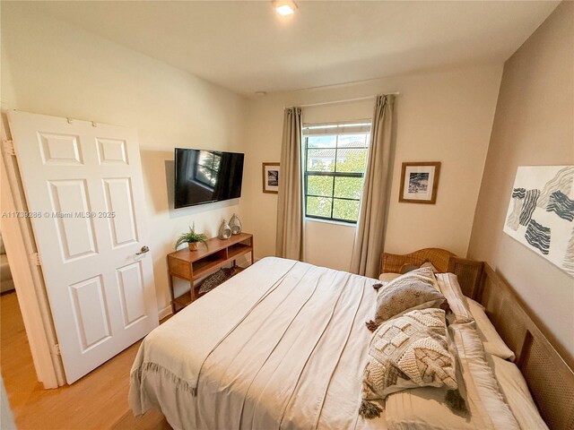 bedroom with light wood-type flooring